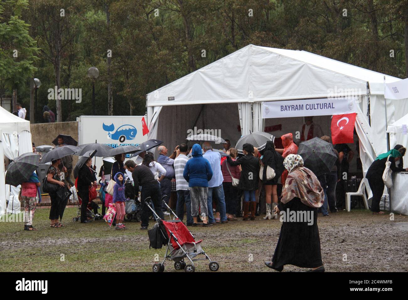 People queue up to have their photo taken with the world’s tallest man Sultan Kosen from Turkey at the Anatolian Turkish Festival in Sydney. Stock Photo