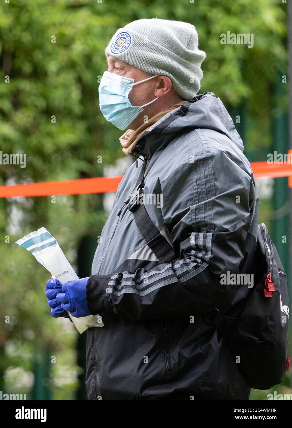 A man in a Leicester City football club hat at a walk-in mobile Covid-19 testing centre at Spinney Hill Park in Leicester as the city may be the first UK location to be subjected to a local lockdown after a spike in coronavirus cases. Stock Photo