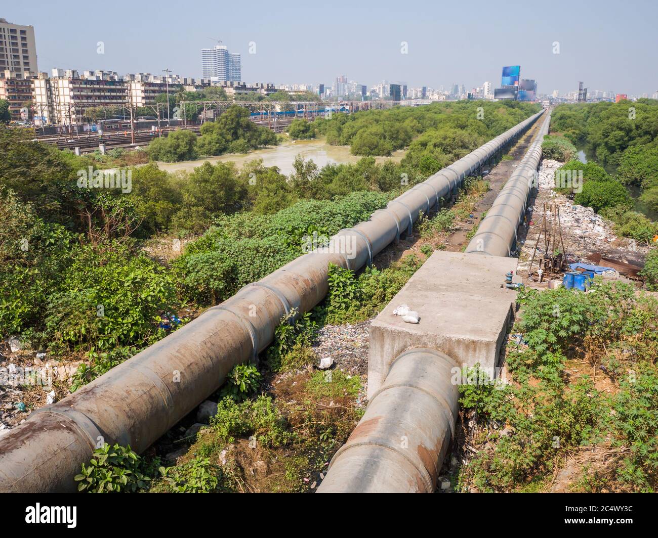 Mumbai, India - December 17, 2019: A thick pipe in a poor area of Mumbai. Stock Photo