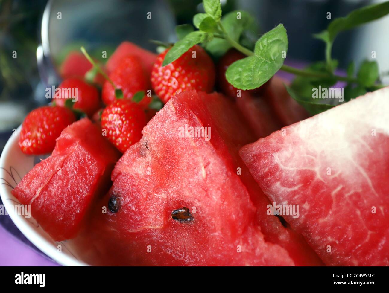 Watermelon, strawberries and mint for healthy eating. Red fruits for detox. Stock Photo
