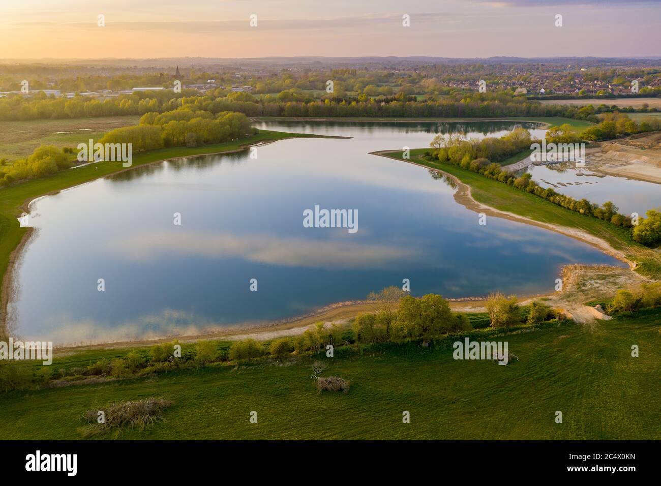 A man made lake, the end result of large scale gravel extraction near Witney in West Oxfordshire, UK Stock Photo