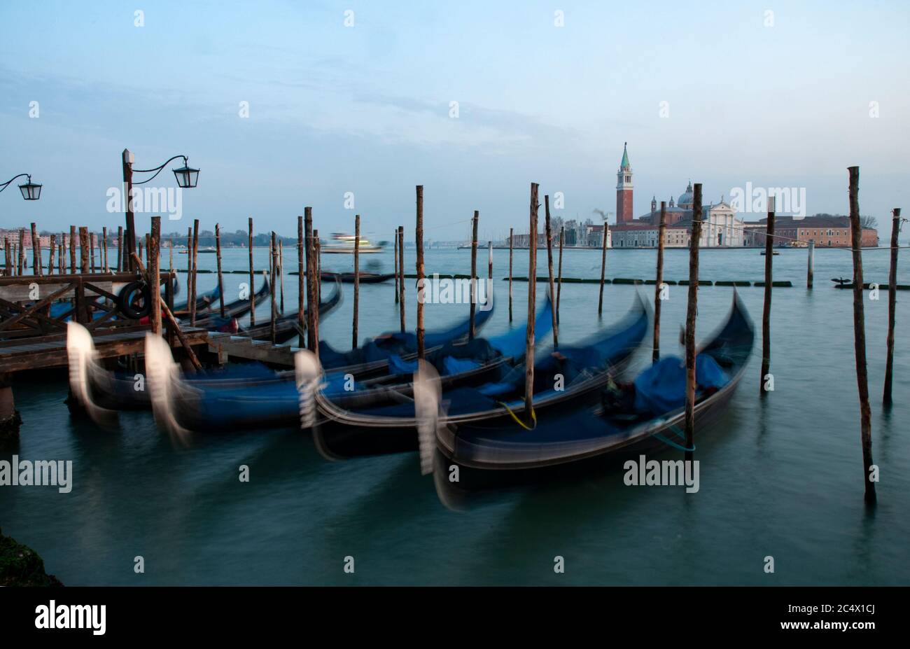 Gondolas parking area in front of St. Mark square in Venice, a breath of sea breeze with no pollution and far from the city noises Stock Photo