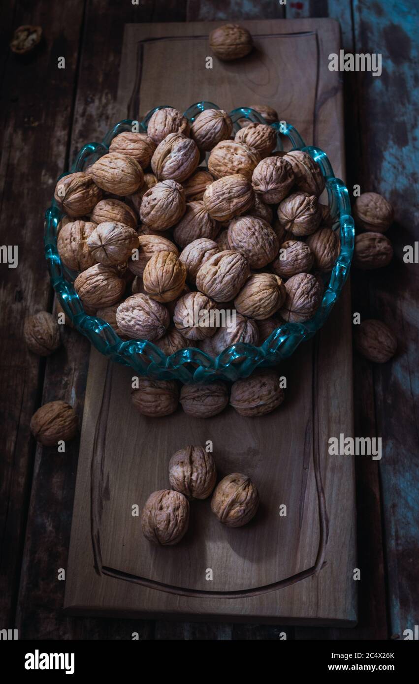Walnuts on light wood table hires stock photography and images Alamy