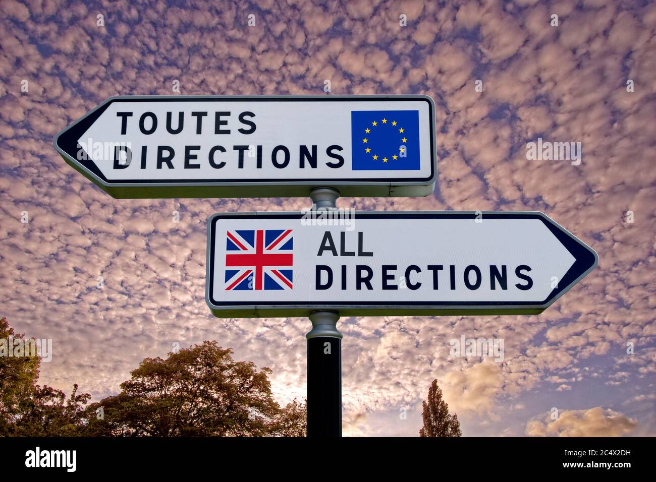 French style double signpost with opposing UK/EU pointers. Stock Photo