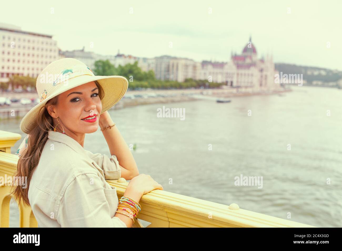 Young Latina woman in hat visiting Budapest, Hungary Stock Photo