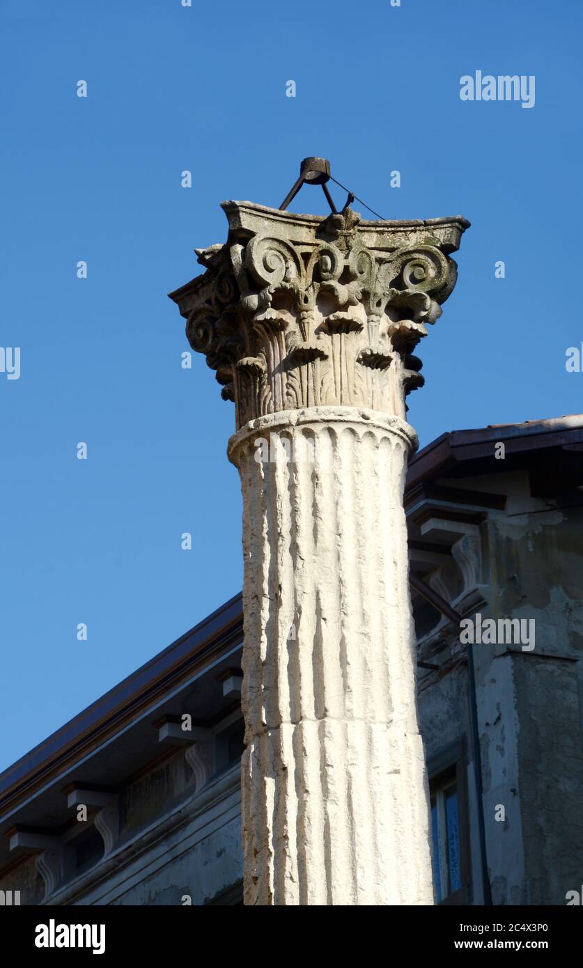 The Corinthian column of ordien del Crotacio place of martyrdom of Saint Alexander in the churchyard of the Basilica of Saint Alexander. Stock Photo