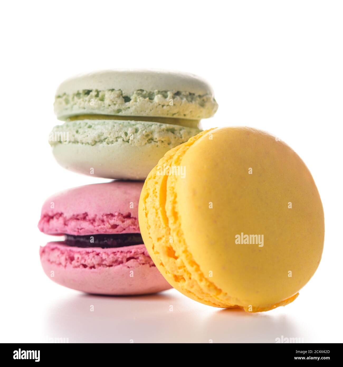 Three macaroons on white background. Stock Photo