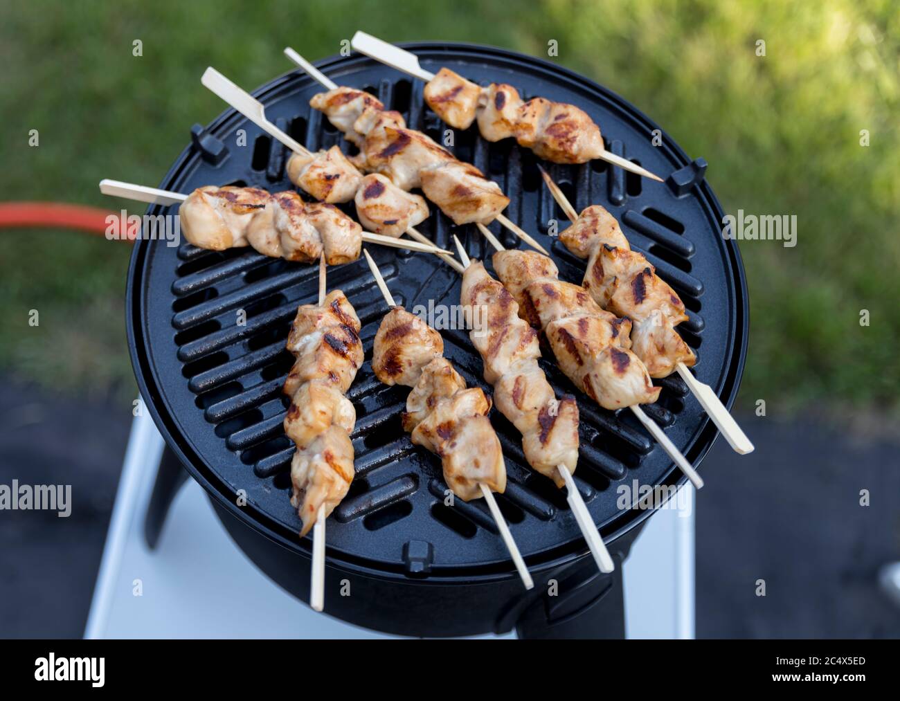 electrical bbq with grill plate for a nice chicken sate Stock Photo