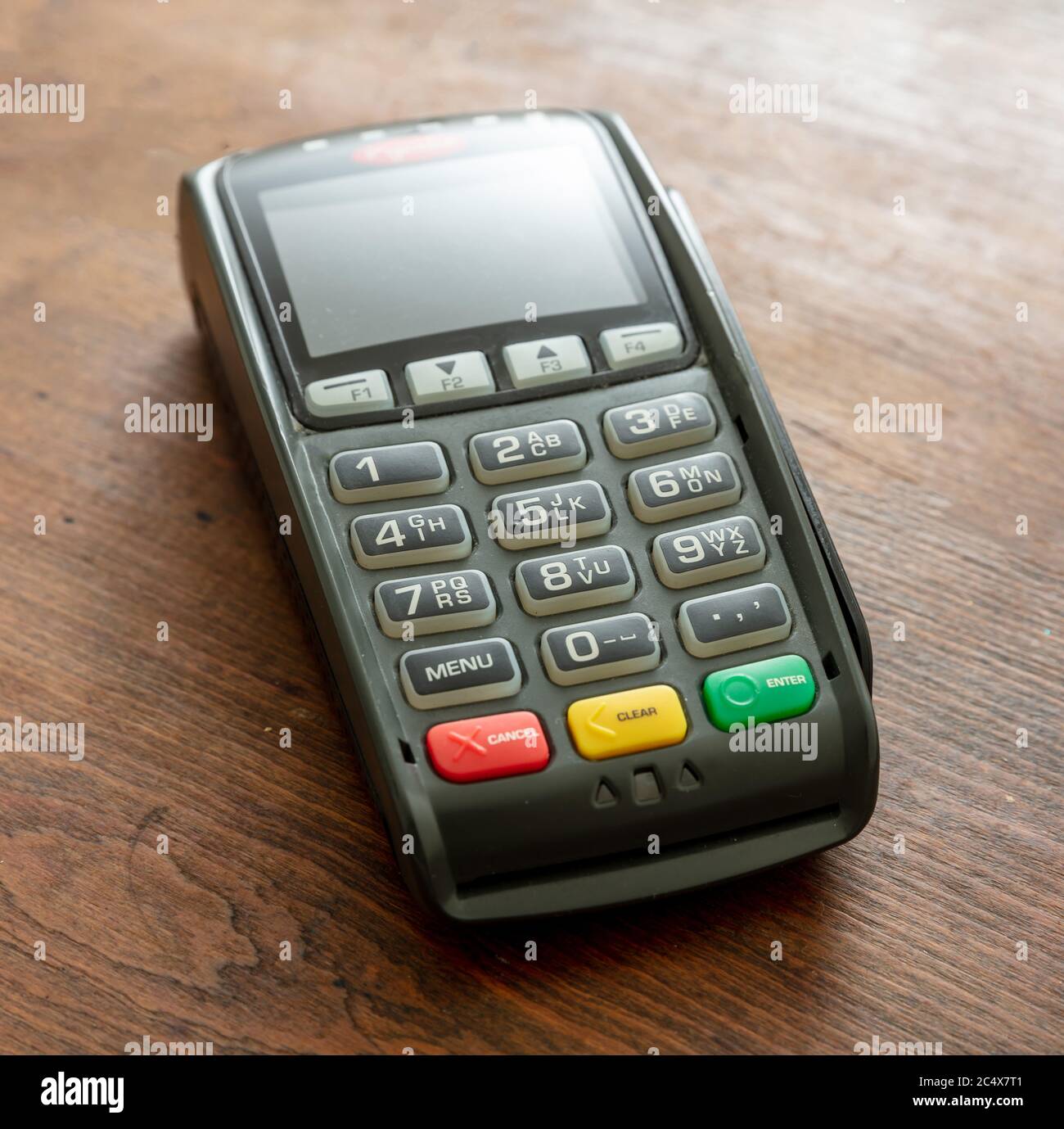 POS terminal isolated on wooden background, closeup view.Terminal cash ...