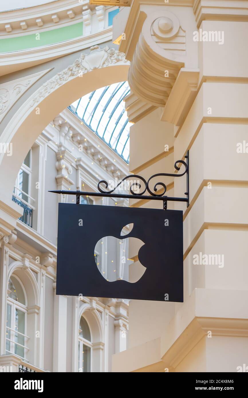 The Hague, The Netherlands - January 15, 2020: Apple Computer logo hanging above a Mac store front in The Hague, The Netherlands Stock Photo