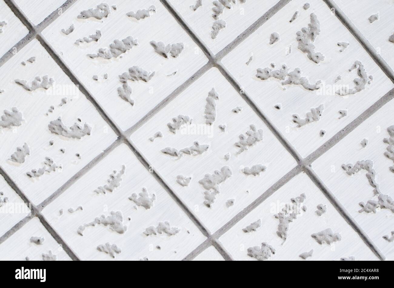 Gray-white concrete texture. Geometric background with square pattern. Close-up Stock Photo