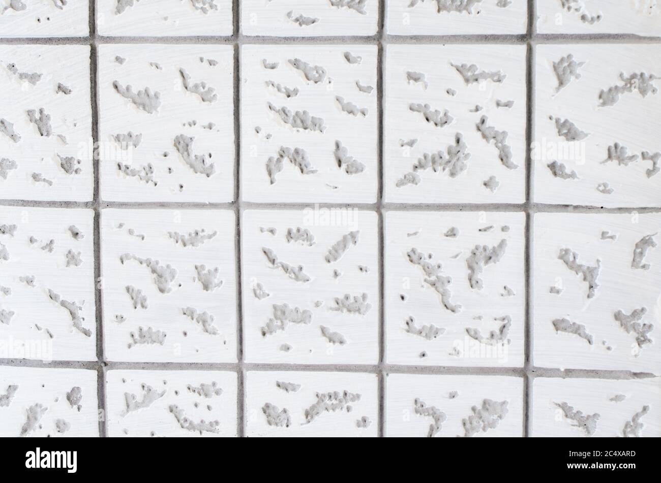 Gray-white concrete texture. Geometric background with square pattern. Close-up Stock Photo