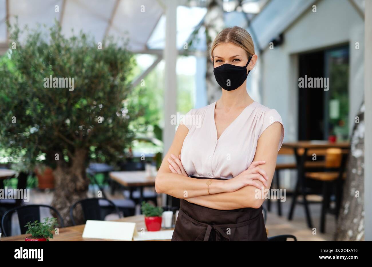 Portrait waitress standing arms hi-res stock photography and images - Alamy