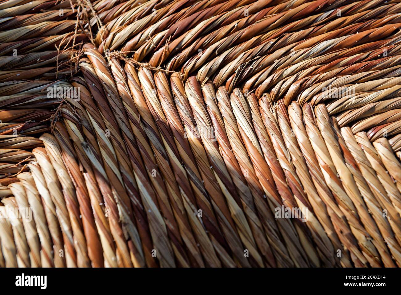 A traditional greek taverna straw chair seat. Top view. Natural background. Stock Photo
