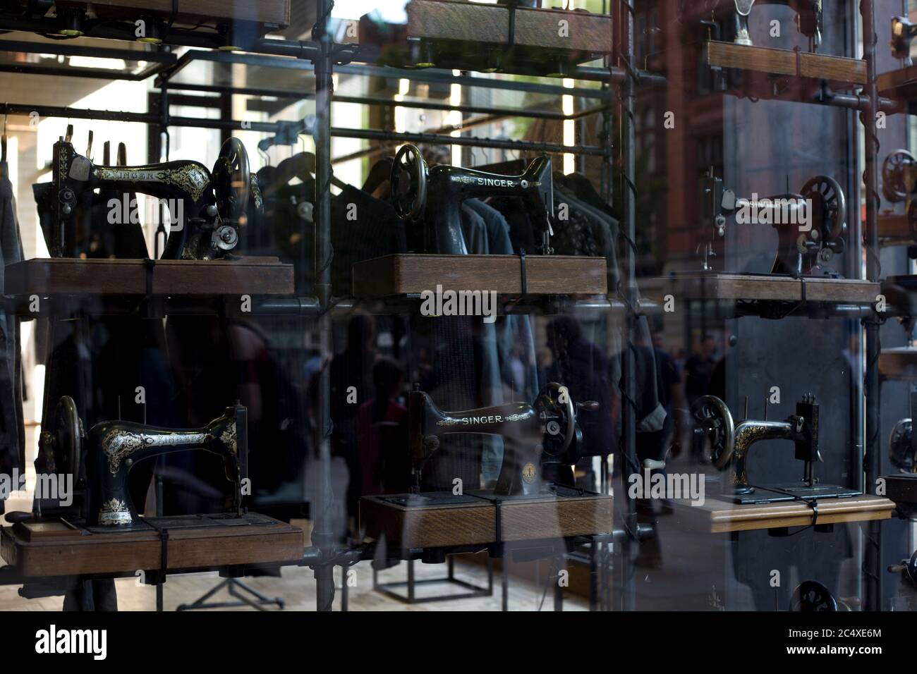 A shops window display with old Singer sewing machines. Creative