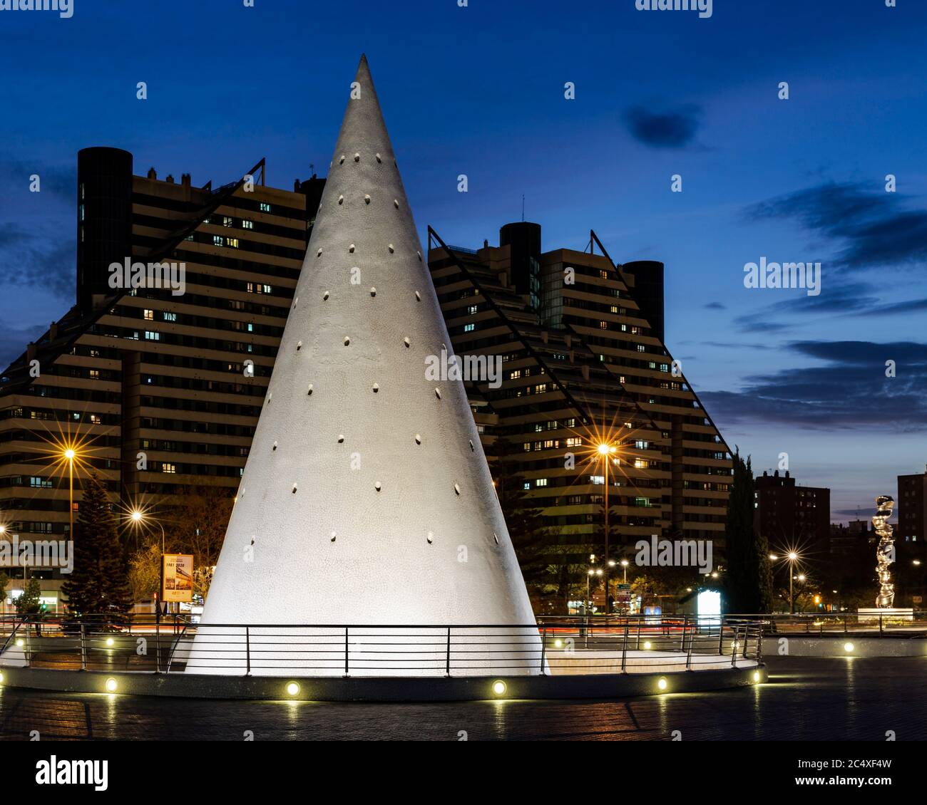 White conical elevator shaft lit up at night, the Science and Arts park, Valencia, Spain. Stock Photo