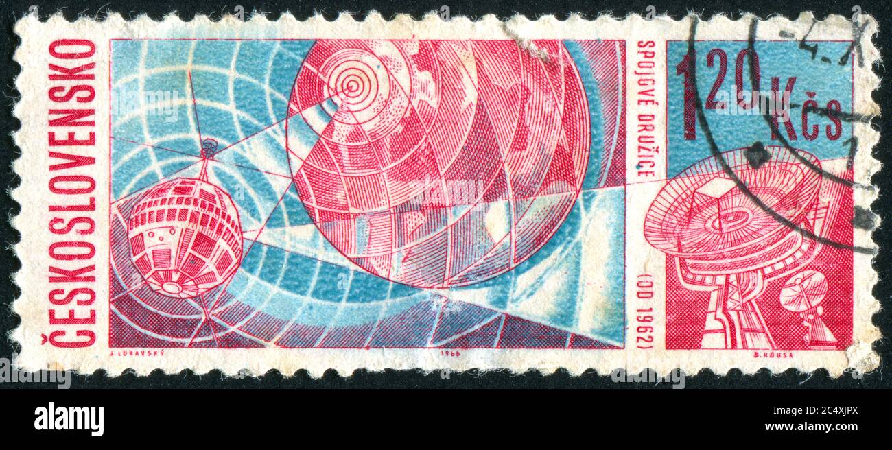 CZECHOSLOVAKIA - CIRCA 1966: stamp printed by Czechoslovakia, shows Telstar over Earth & receiving station, circa 1966 Stock Photo