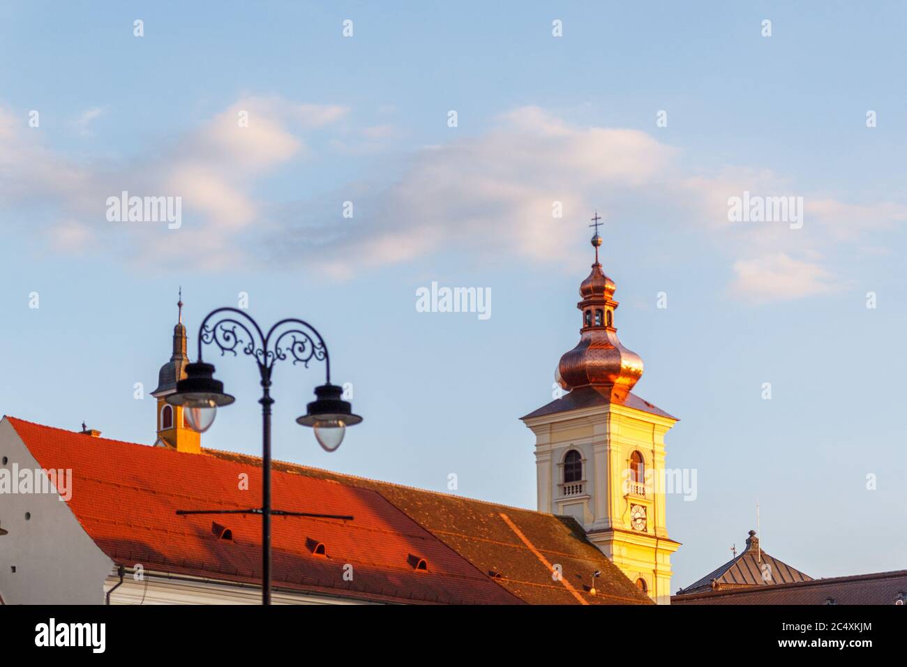 SIBIU, ROMANIA - Circa 2020: Old medieval town with cloudy blue sky. Beautiful tourist spot in eastern central Europe. Famous old medieval tower in Si Stock Photo