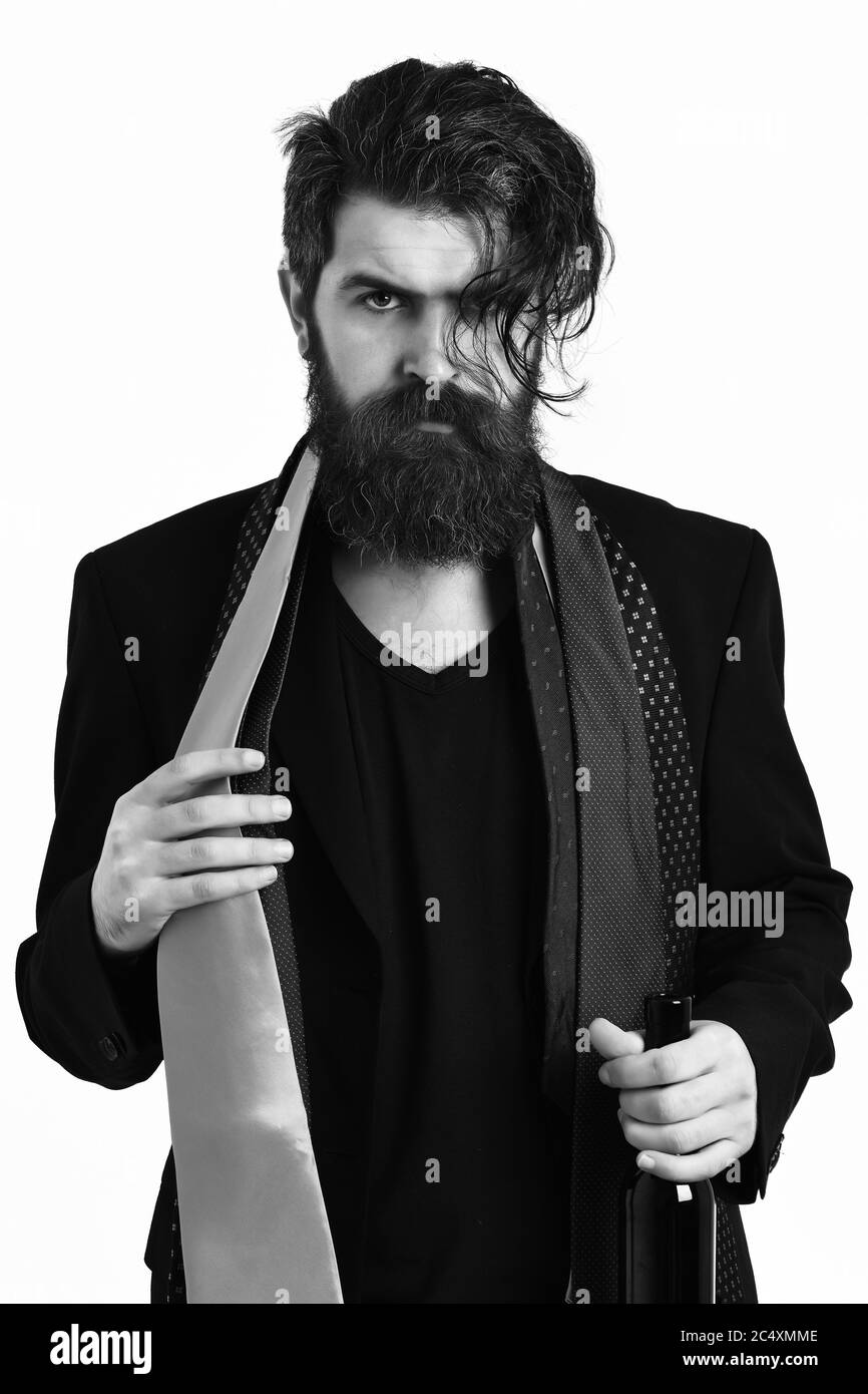 Bearded man, long beard. Brutal caucasian hipster with moustache in black suit with colorful ties on shoulders holding bottle isolated on white studio background Stock Photo - Alamy Bearded man, long beard. Brutal caucasian hipster with moustache in black suit with colorful ties on shoulders holding bottle isolated on white studio background Stock Photo - Alamy