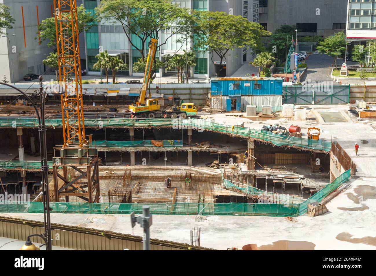 HONG KONG, CHINA - CIRCA 2020: Skyscraper excavator dismantling a ...