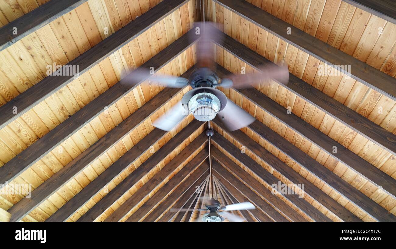 wooden roof with interior ceiling fan Stock Photo