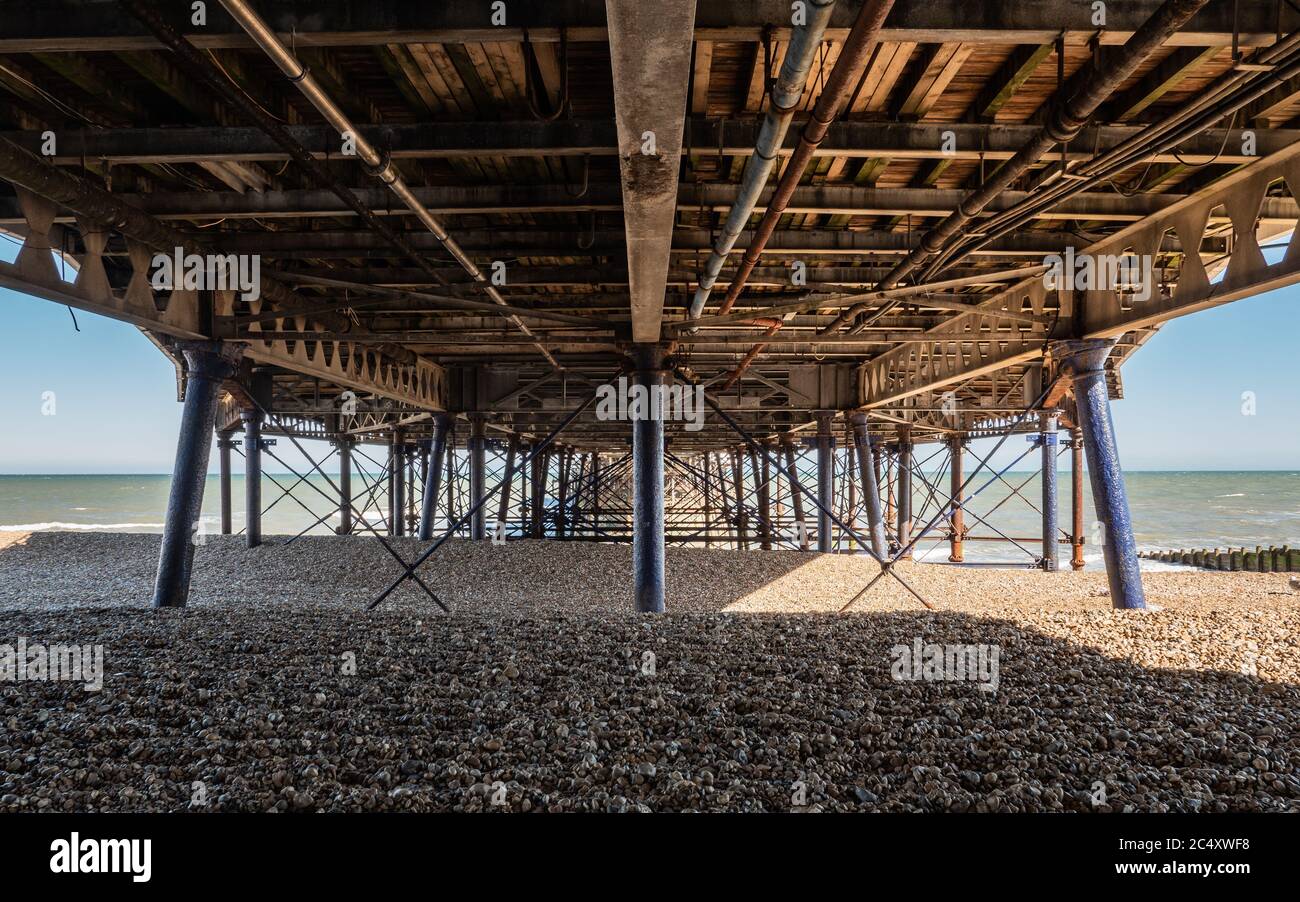 Eastbourne Pier, England. An abstract view under the Victorian architecture of the pier in the popular seaside town on the south coast of England. Stock Photo