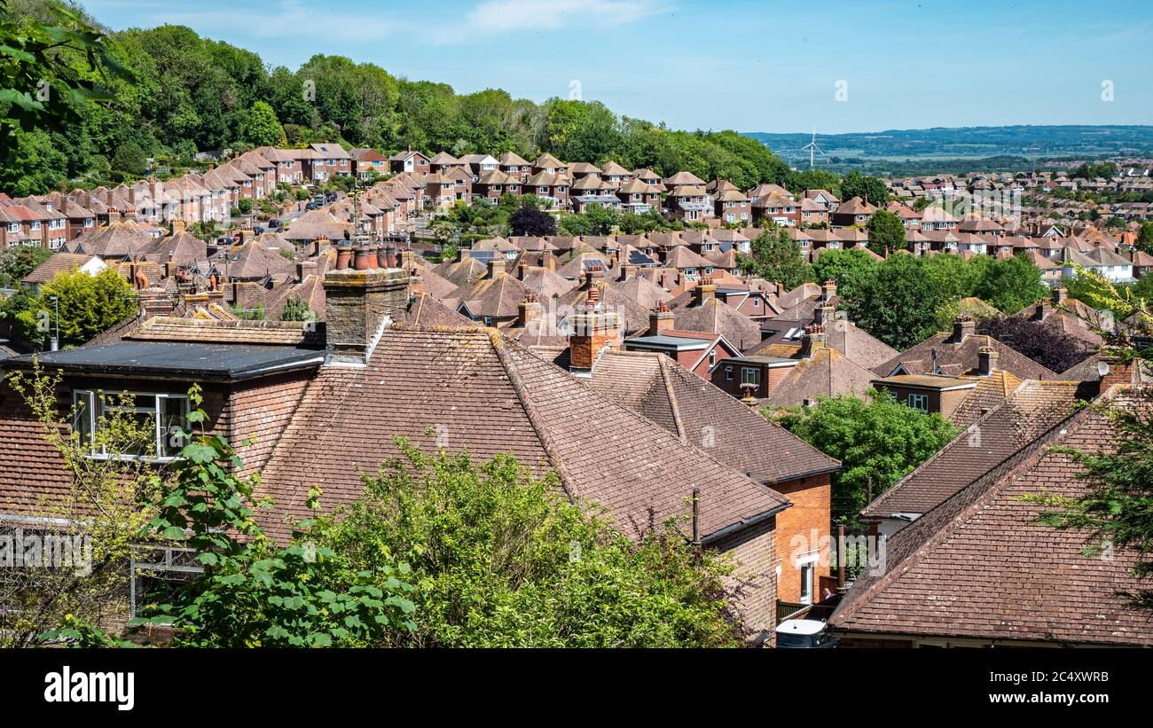 Old Town, Eastbourne. Suburban rooftops of post-war houses edging into the surrounding forests of the South Downs countryside of East Sussex, England. Stock Photo