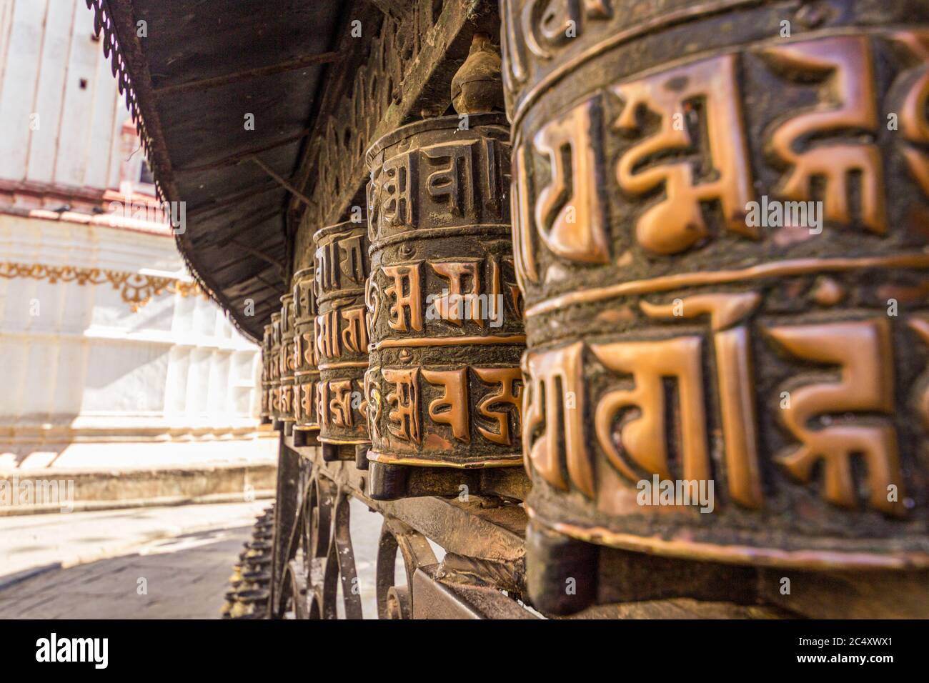 Tibetan prayer wheels or prayer's rolls of the faithful Buddhists. Stock Photo