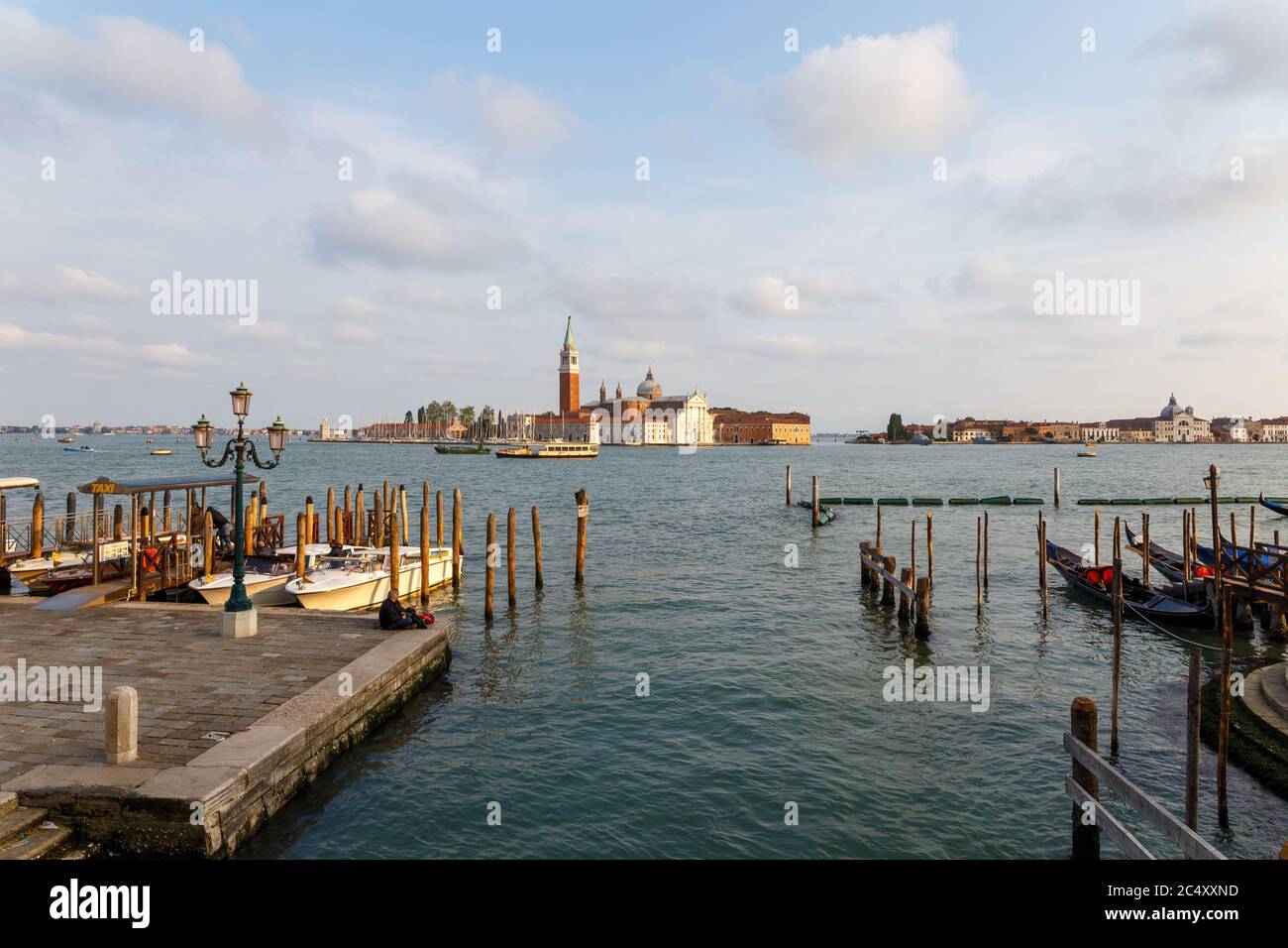 Venice, Italy - CIRCA 2020: View of an empty water canal in Venice Italy. Concept of the effects of lock down due to CoronaVirus COVID-19. Picturesque Stock Photo