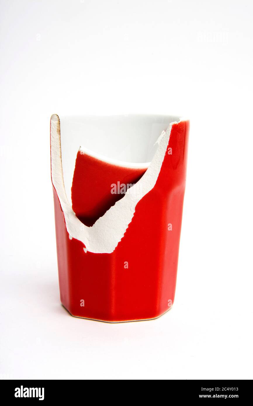 Close-up of a broken coffee cup on a white background Stock Photo