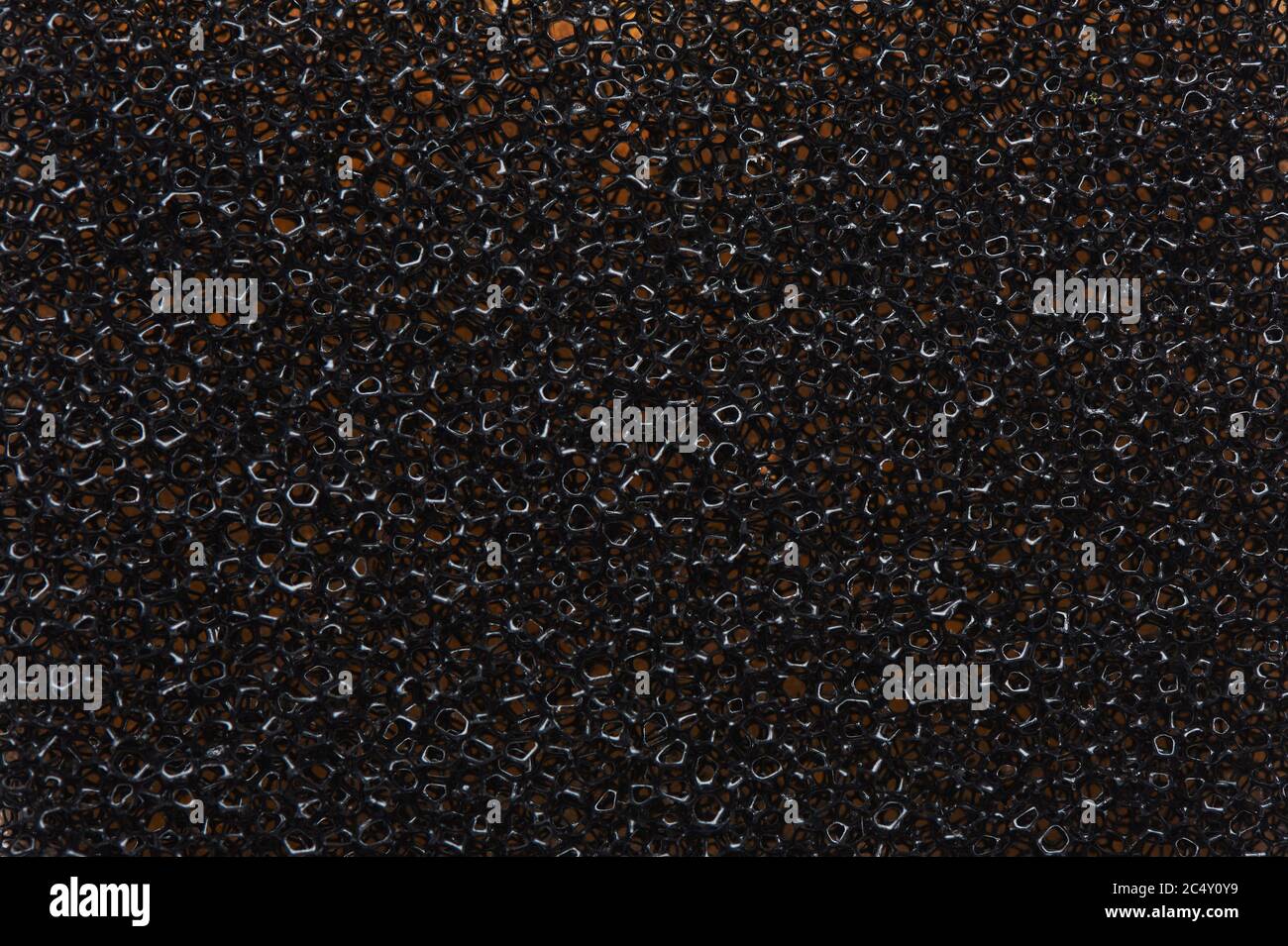 Black sponge texture background close up. Stock Photo