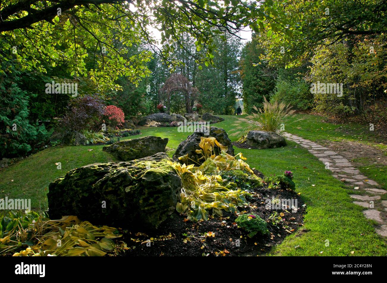 Backyard garden of the  tourist resort in Ontario, Canada with a footpath in stone material Stock Photo