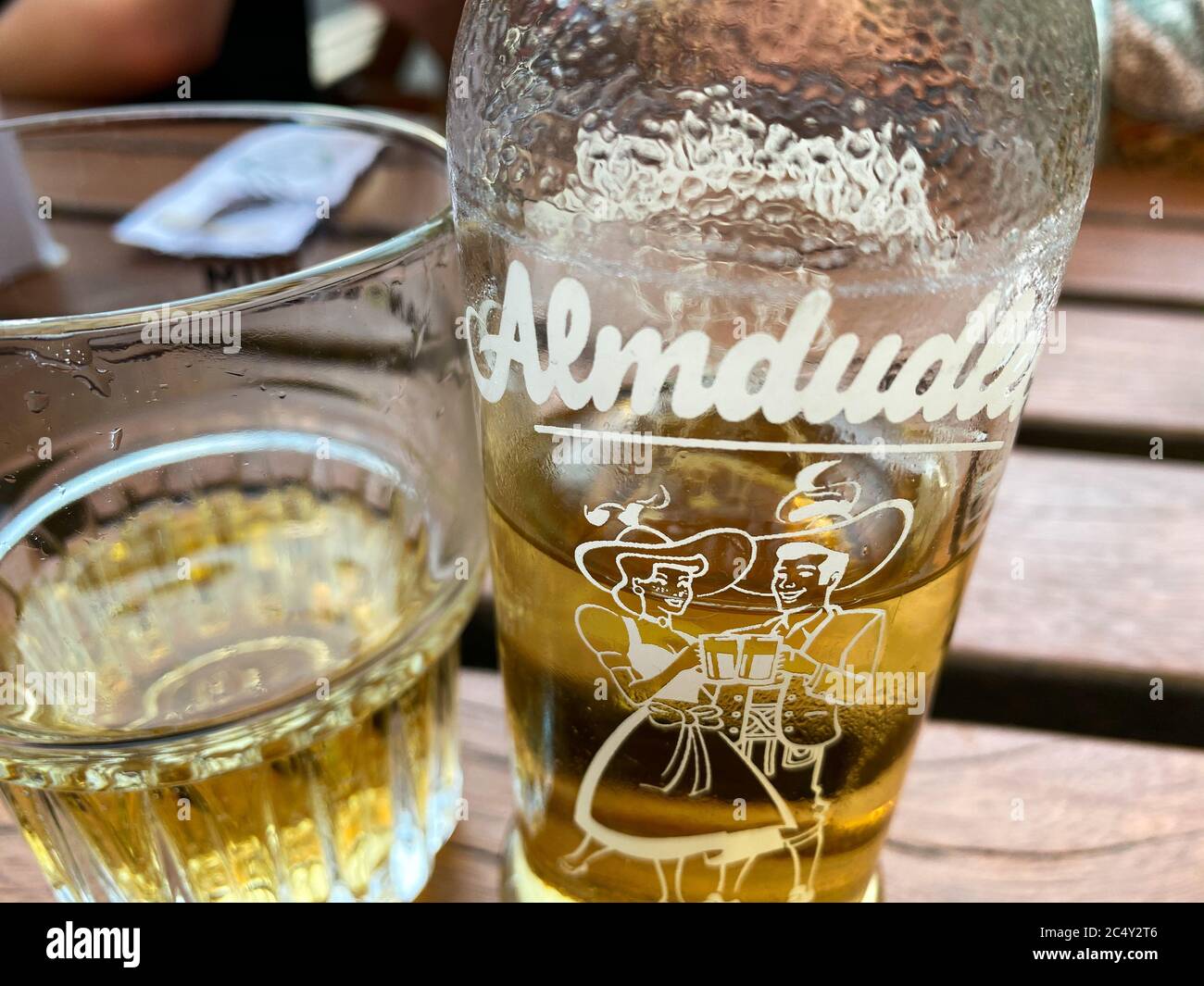 Haarlem, Netherlands - June 25. 2020: View on isolated glass and bottle of austrian herb extract lemonade on wood table Stock Photo