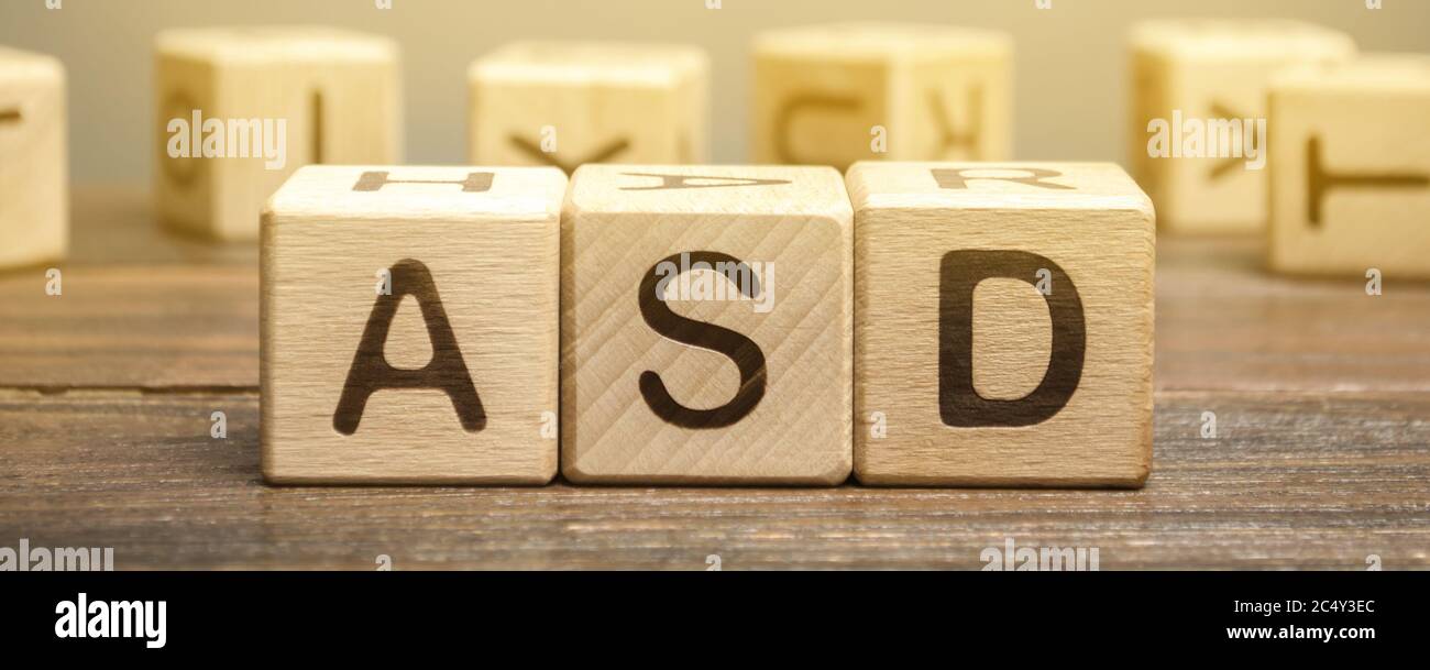 Wooden blocks with the word ASD - Autism Spectrum Disorder. Neurological and developmental disorder Stock Photo