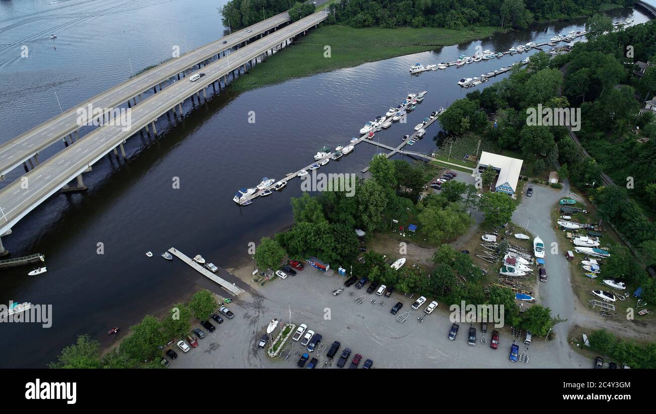 Aerial view of the Delaware River with recreational boaters on it, divided by the New Jersey Turnpike in Bordentown, New Jersey Stock Photo