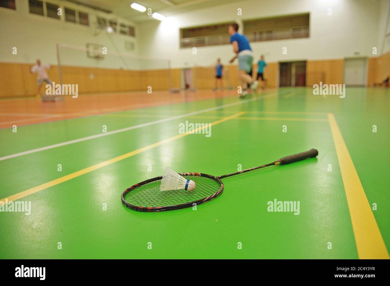 badminton courts with players competing Stock Photo Alamy