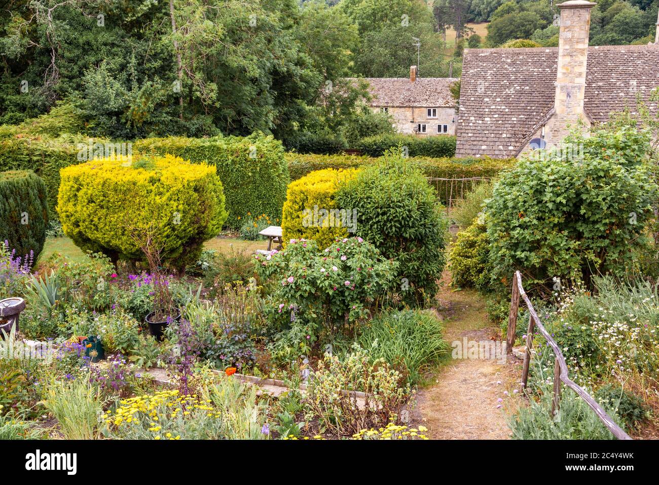 A cottage garden in the Cotswold village of Sapperton, Gloucestershire UK Stock Photo