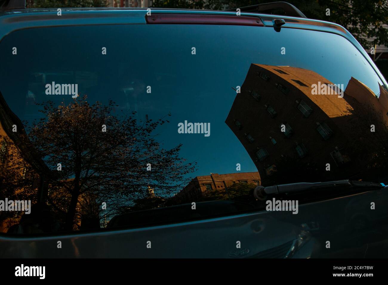 A street reflection in a car's rear window Stock Photo Alamy