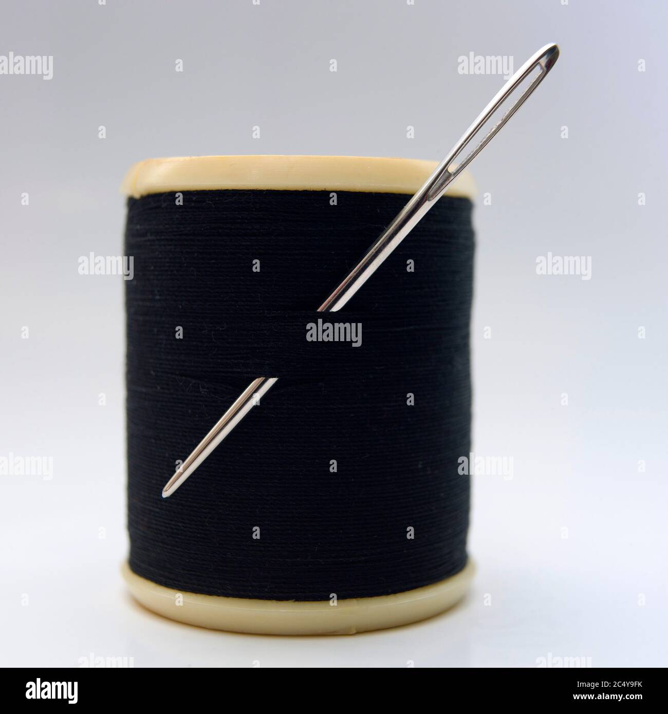 Sewing Needle With Black Thread Stuck In Wooden Spool With Black Threads  Close Up Isolated On White Background Stock Photo - Download Image Now -  iStock