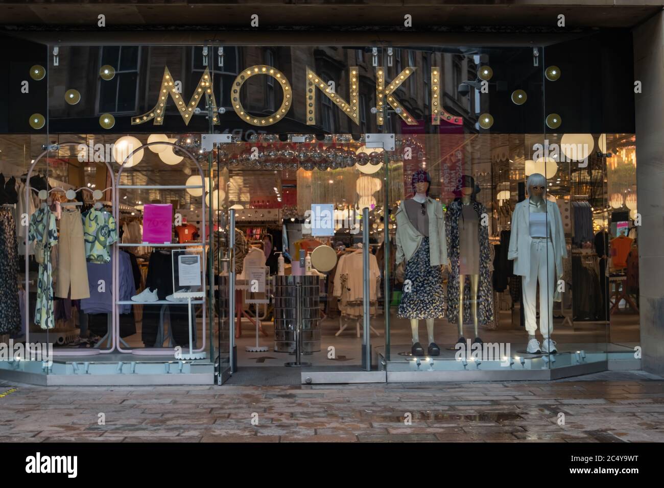 Glasgow, Scotland, UK. 29th June, 2020.  Monki on Sauchiehall Street is now open to shoppers as shops allowed to reopen for business today with the further easing of the coronavirus lockdown rules. Credit: Skully/Alamy Live News Stock Photo