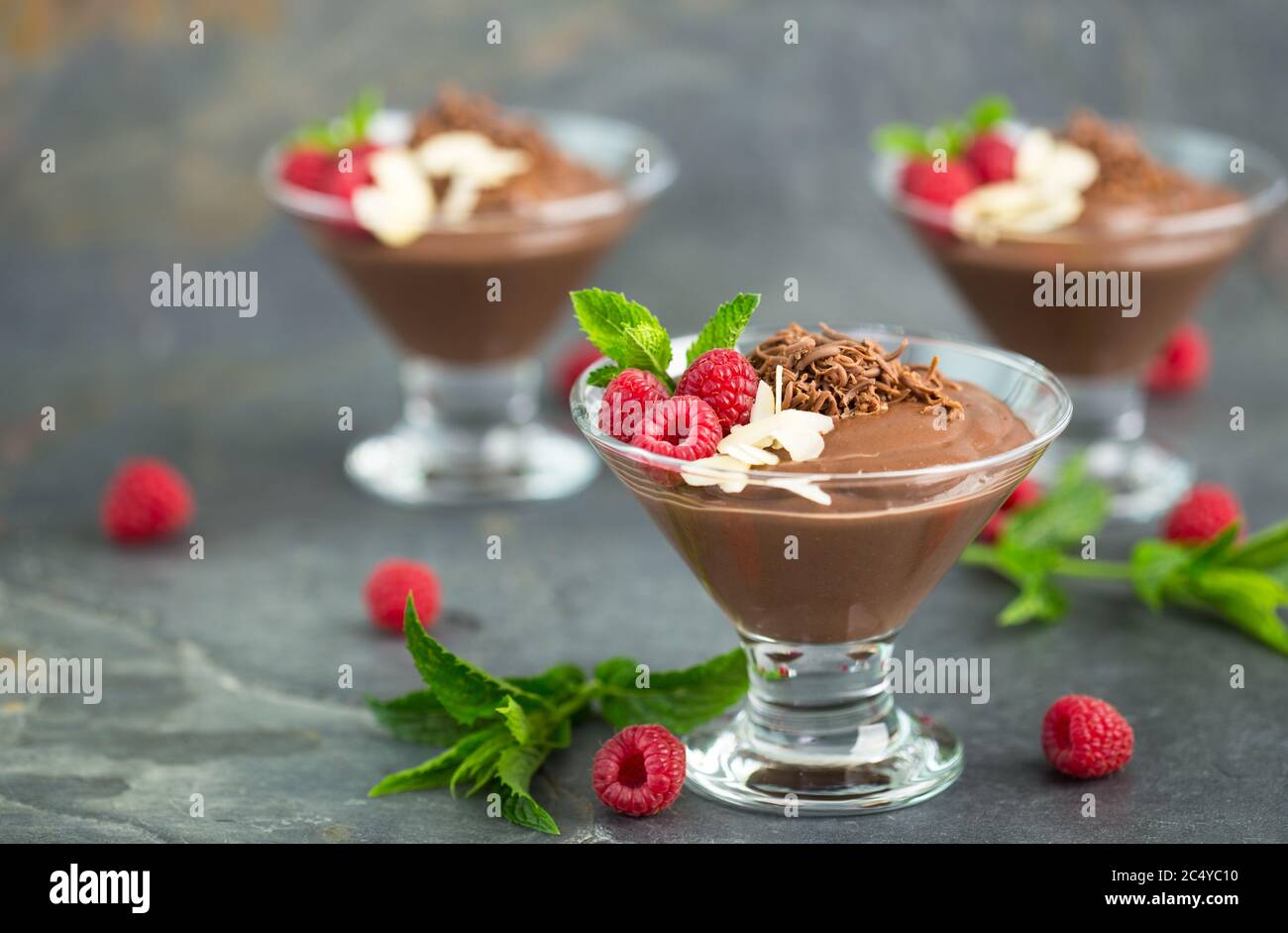 Chocolate mousse with raspberry, mint and almonds Stock Photo