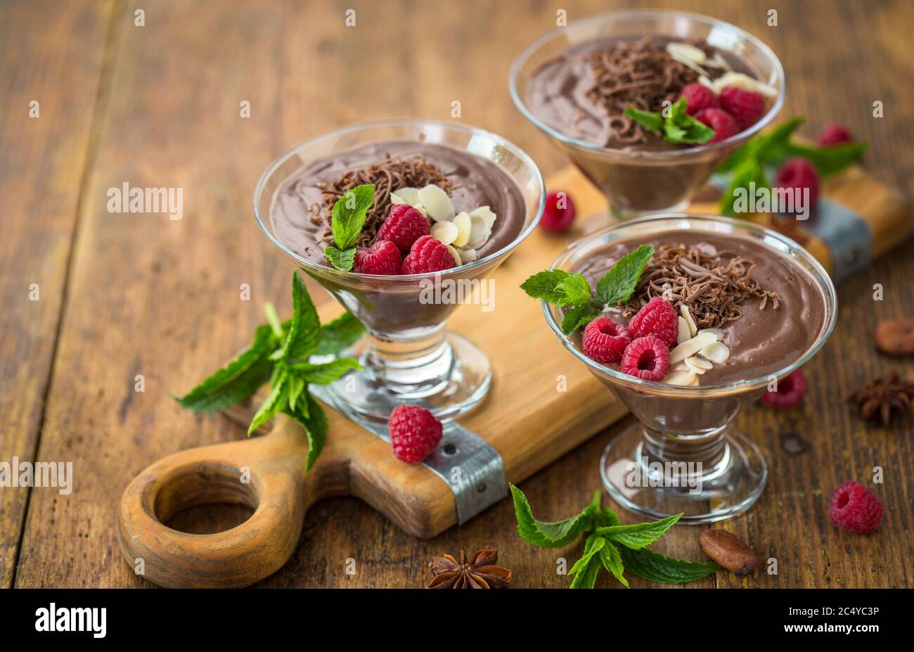 Chocolate mousse with raspberry, mint and almonds Stock Photo