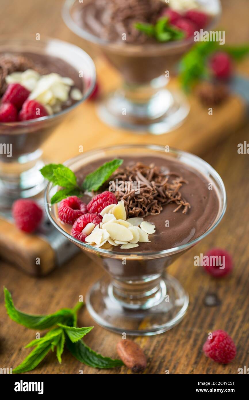 Chocolate mousse with raspberry, mint and almonds Stock Photo
