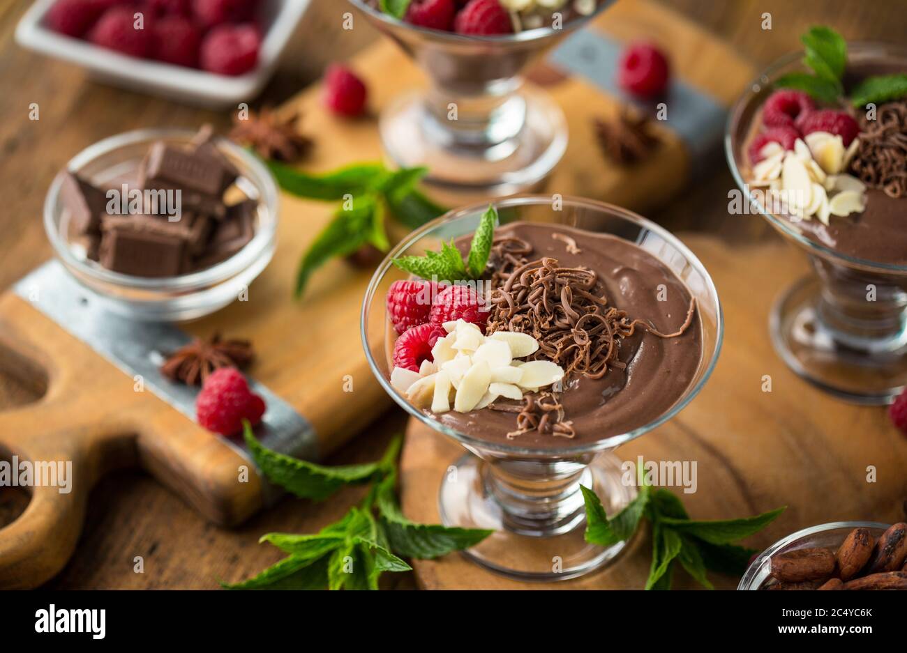Chocolate mousse with raspberry, mint and almonds Stock Photo