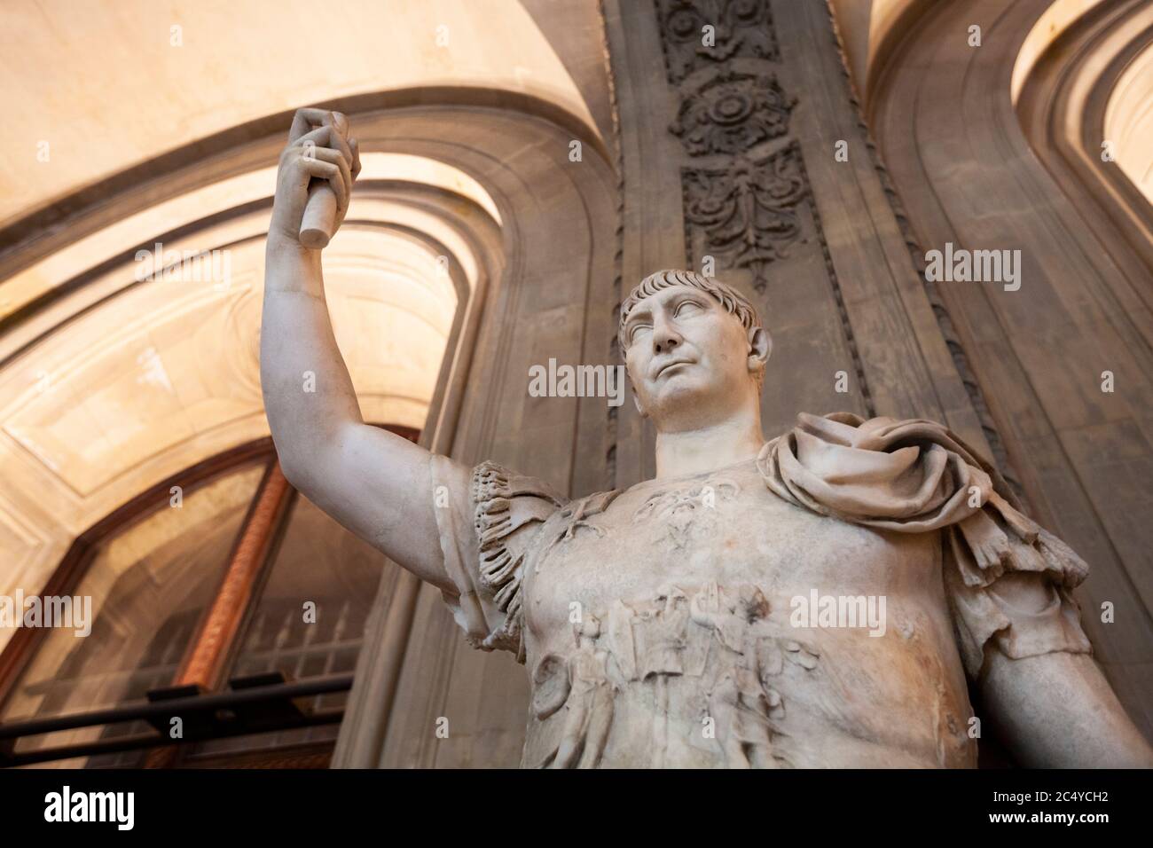 A Roman statue of Julius Caesar holding a scroll in the Louvre Museum, Paris Stock Photo