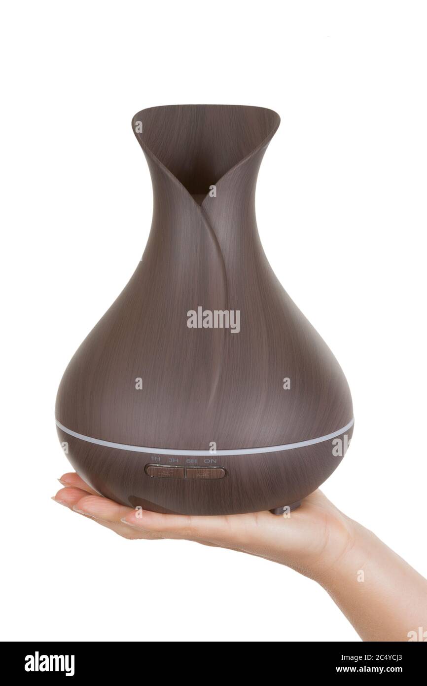 Aromatherapy Concept Wooden Electric Ultrasonic Essential Oil Aroma Diffuser And Humidifier In Woman Hand On A White Background Stock Photo Alamy