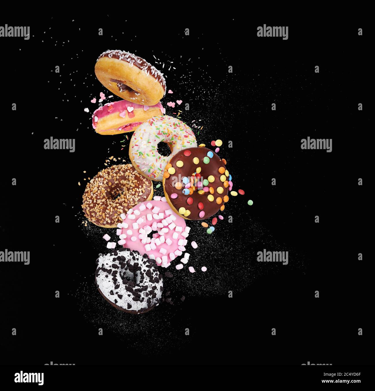 colorful donuts on black background Stock Photo