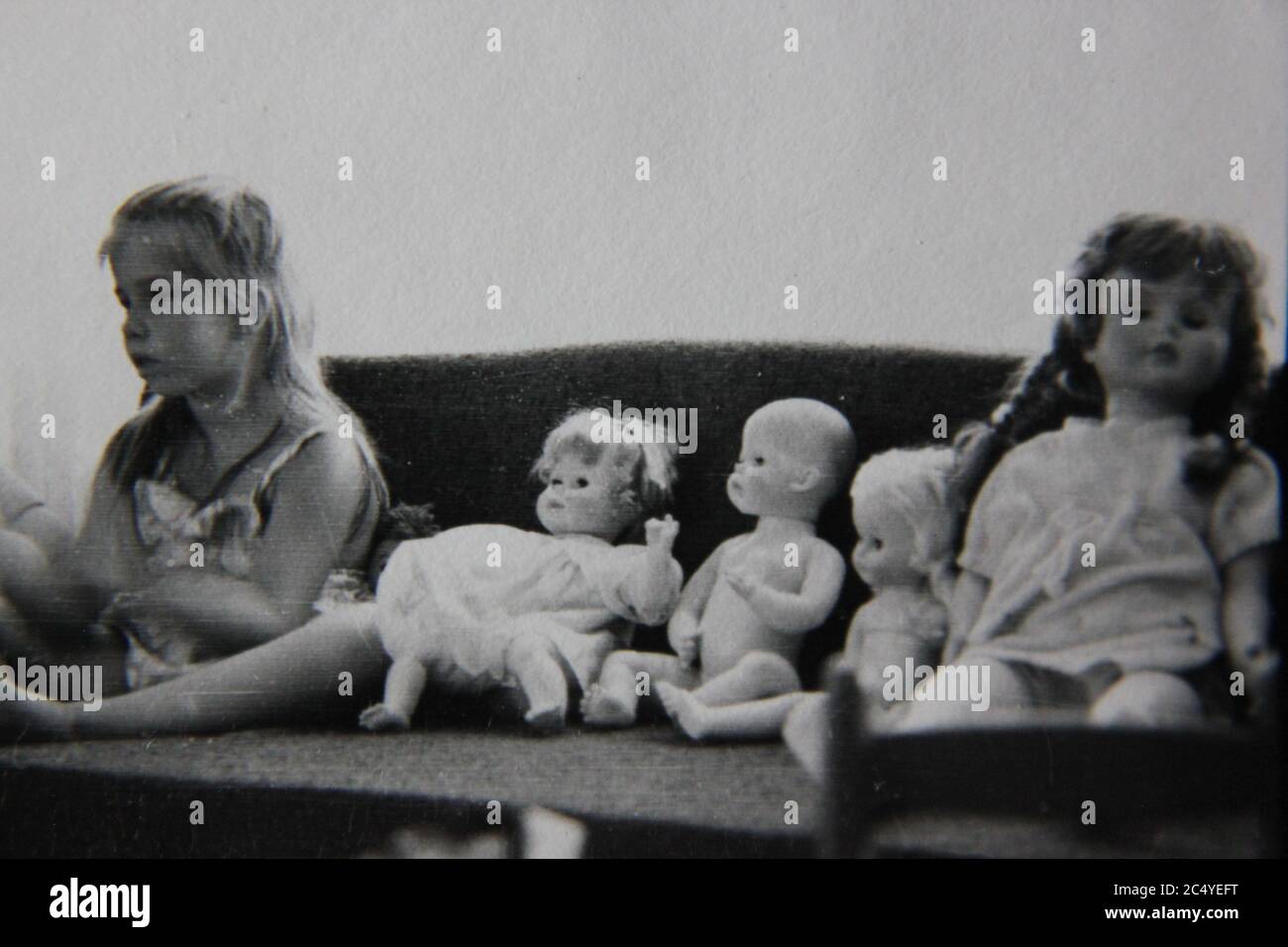 Girl playing with dolls house hi-res stock photography and images - Alamy
