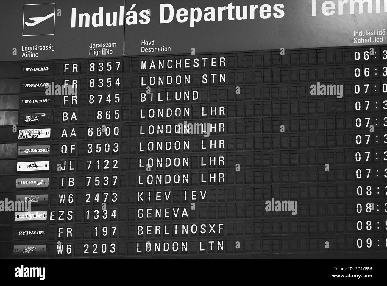 Departures board at the airport. Flight information mechanical ...