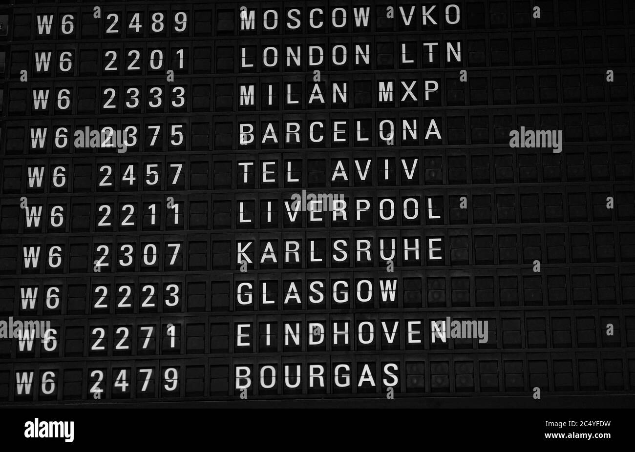 Departures board at the airport. Flight information mechanical ...